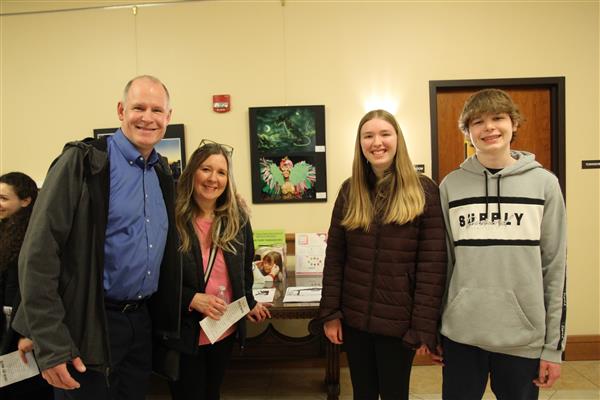 student and family with art